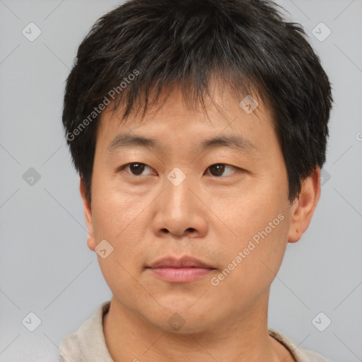 Neutral asian young-adult male with short  brown hair and brown eyes