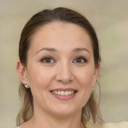 Joyful white young-adult female with medium  brown hair and brown eyes