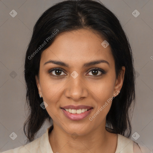 Joyful black young-adult female with medium  brown hair and brown eyes