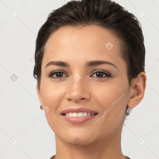 Joyful white young-adult female with short  brown hair and brown eyes