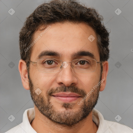 Joyful white adult male with short  brown hair and brown eyes