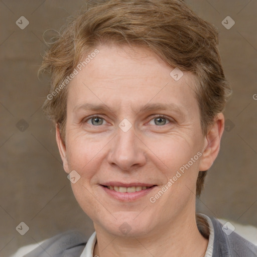 Joyful white adult female with short  brown hair and grey eyes