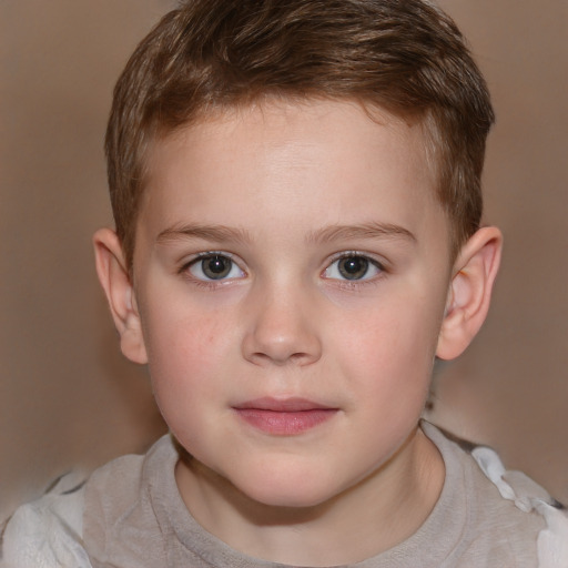 Joyful white child male with short  brown hair and brown eyes