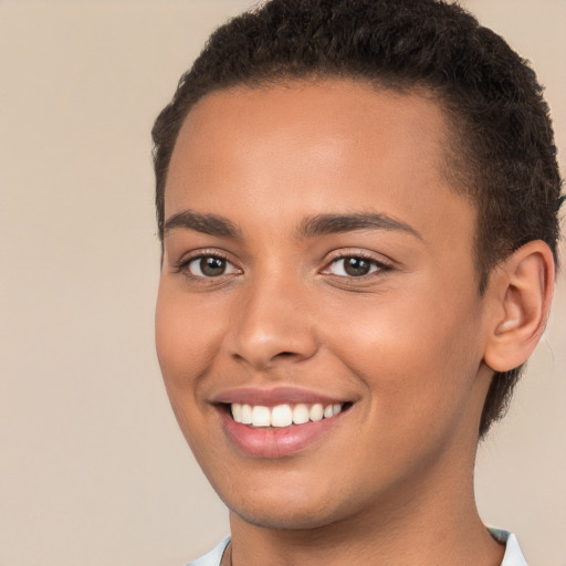 Joyful white young-adult female with short  brown hair and brown eyes