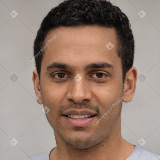 Joyful white young-adult male with short  black hair and brown eyes