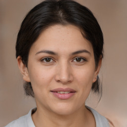 Joyful white young-adult female with medium  brown hair and brown eyes