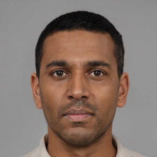 Neutral black young-adult male with short  black hair and brown eyes