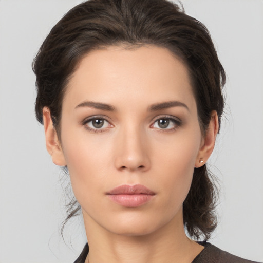 Neutral white young-adult female with medium  brown hair and brown eyes