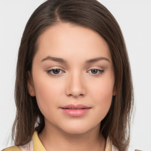 Neutral white young-adult female with long  brown hair and brown eyes