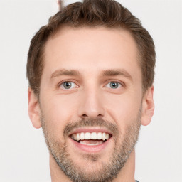 Joyful white young-adult male with short  brown hair and brown eyes