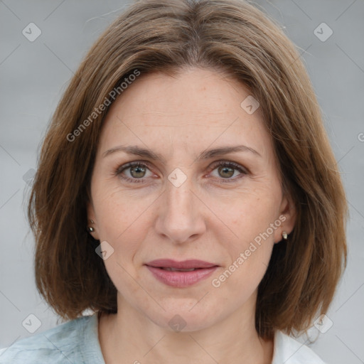 Joyful white adult female with medium  brown hair and brown eyes