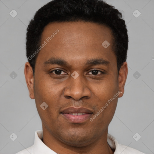 Joyful latino young-adult male with short  brown hair and brown eyes