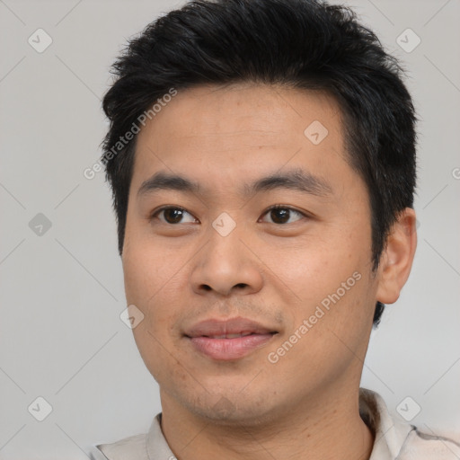 Joyful asian young-adult male with short  brown hair and brown eyes