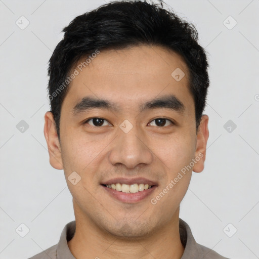 Joyful white young-adult male with short  black hair and brown eyes