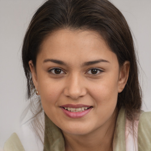 Joyful white young-adult female with medium  brown hair and brown eyes