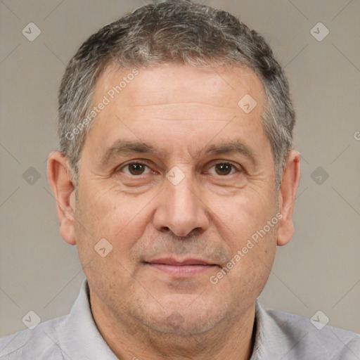 Joyful white middle-aged male with short  brown hair and brown eyes