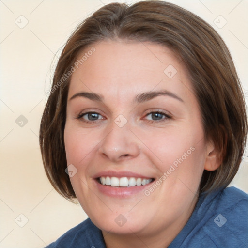 Joyful white young-adult female with medium  brown hair and blue eyes