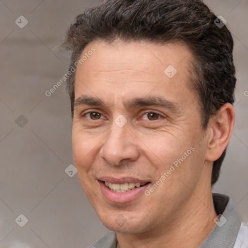 Joyful white adult male with short  brown hair and brown eyes