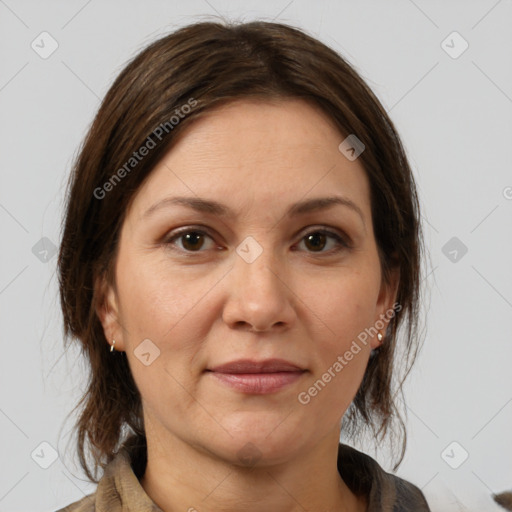 Joyful white adult female with medium  brown hair and brown eyes