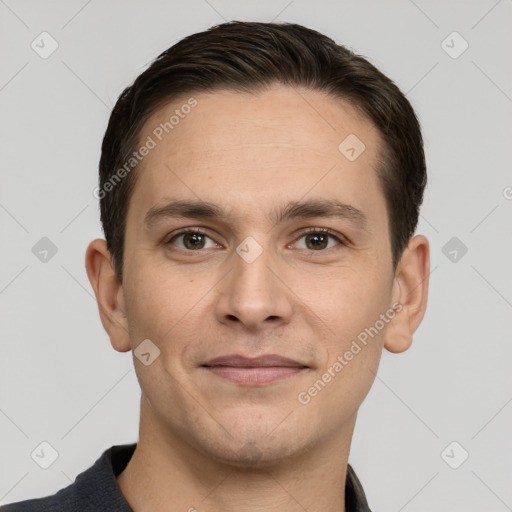 Joyful white young-adult male with short  brown hair and brown eyes