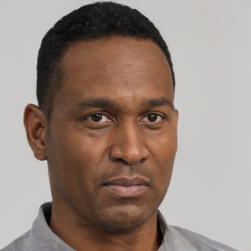 Neutral black young-adult male with short  brown hair and brown eyes
