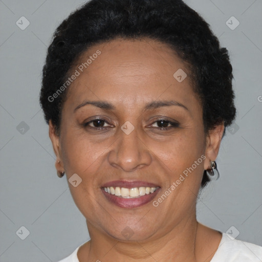 Joyful latino adult female with short  brown hair and brown eyes