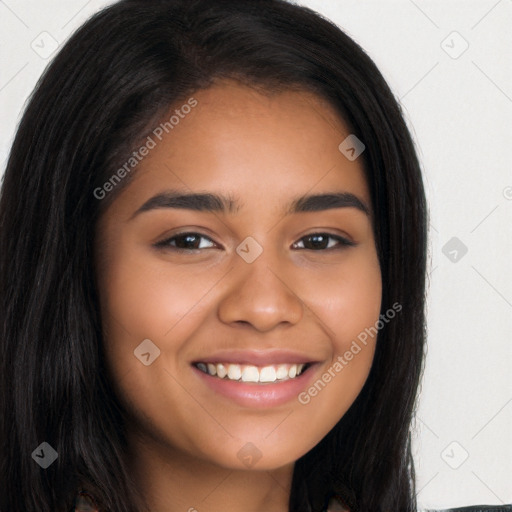 Joyful latino young-adult female with long  brown hair and brown eyes