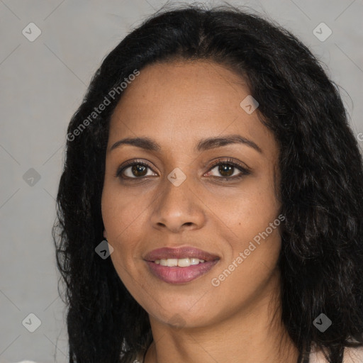 Joyful black young-adult female with long  black hair and brown eyes