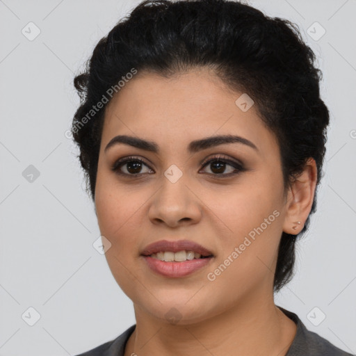 Joyful latino young-adult female with short  black hair and brown eyes