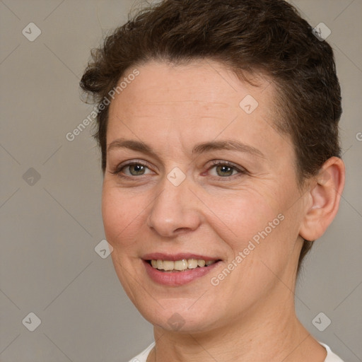 Joyful white adult female with short  brown hair and brown eyes