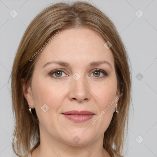 Joyful white adult female with medium  brown hair and grey eyes