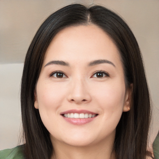 Joyful white young-adult female with long  black hair and brown eyes