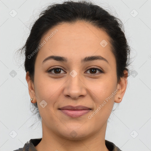 Joyful latino young-adult female with medium  brown hair and brown eyes