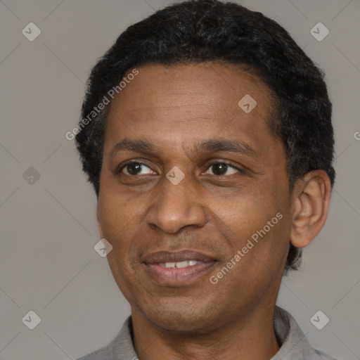 Joyful latino adult male with short  black hair and brown eyes