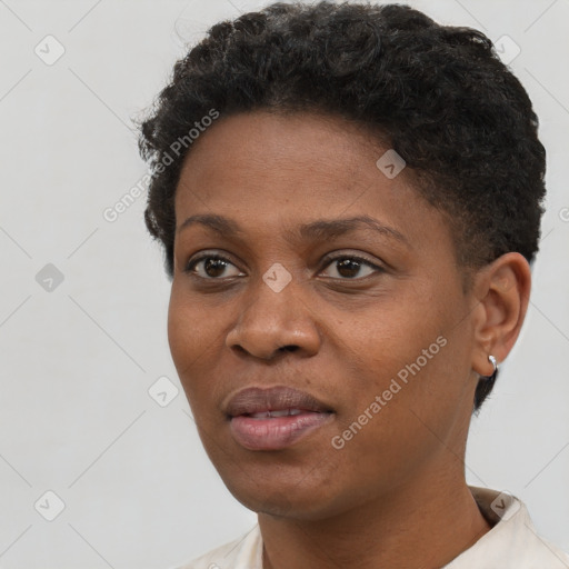 Joyful black young-adult female with short  brown hair and brown eyes