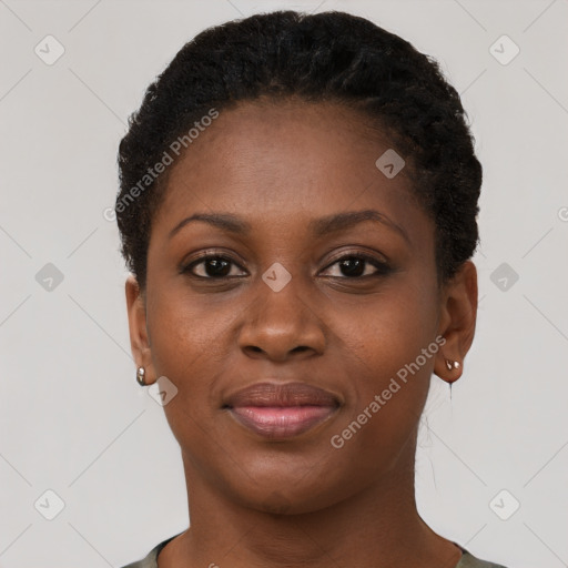 Joyful black young-adult female with short  brown hair and brown eyes