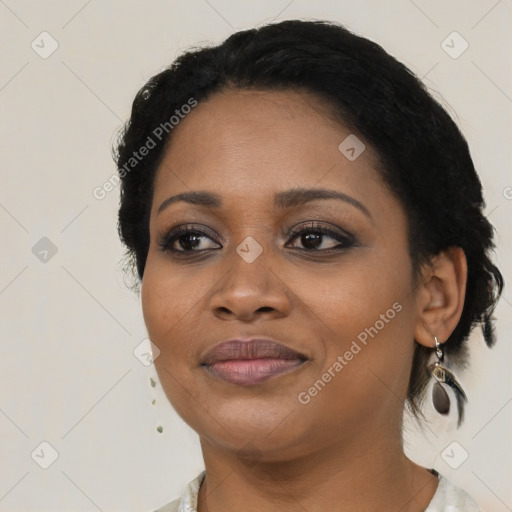 Joyful black young-adult female with medium  black hair and brown eyes