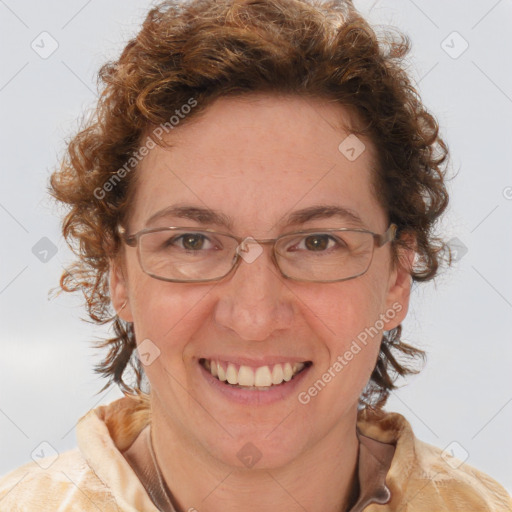 Joyful white adult female with medium  brown hair and blue eyes