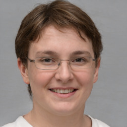 Joyful white adult female with short  brown hair and brown eyes