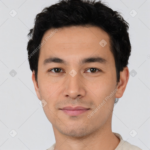 Joyful white young-adult male with short  black hair and brown eyes