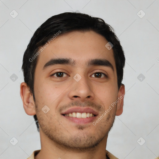 Joyful white young-adult male with short  black hair and brown eyes