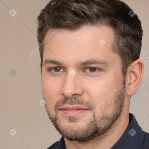 Joyful white adult male with short  brown hair and brown eyes