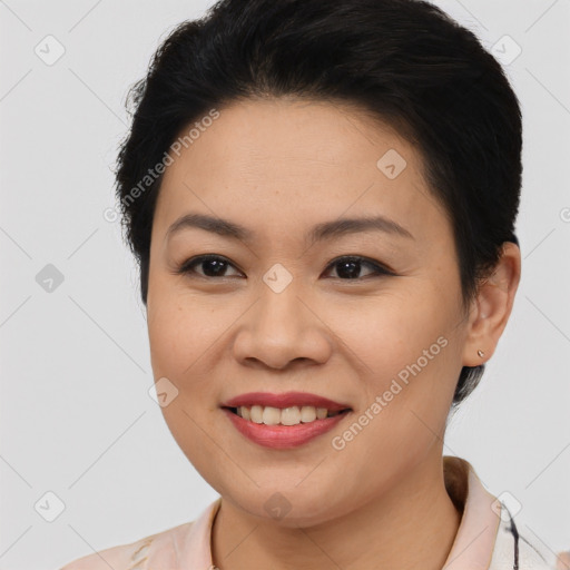 Joyful asian young-adult female with short  brown hair and brown eyes