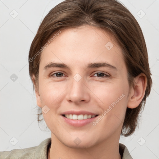 Joyful white young-adult female with medium  brown hair and grey eyes