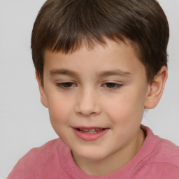 Joyful white child male with short  brown hair and brown eyes