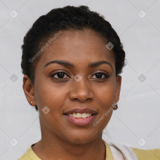 Joyful black young-adult female with short  brown hair and brown eyes