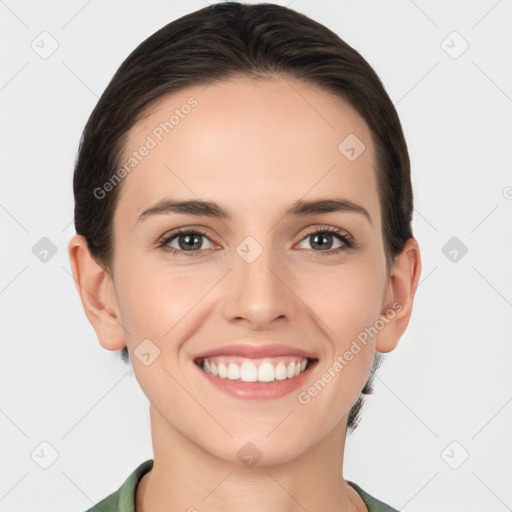 Joyful white young-adult female with medium  brown hair and brown eyes