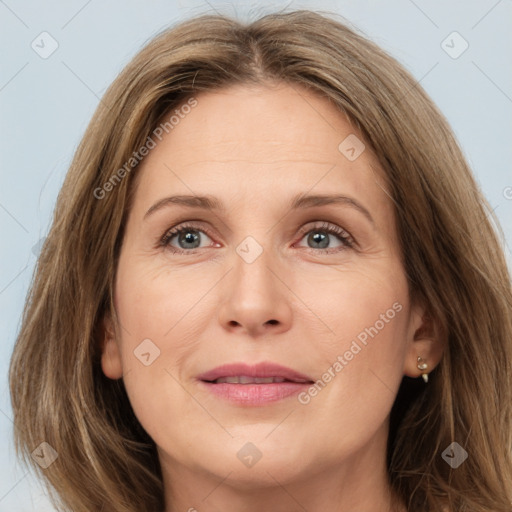 Joyful white adult female with long  brown hair and grey eyes