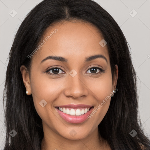 Joyful latino young-adult female with long  brown hair and brown eyes