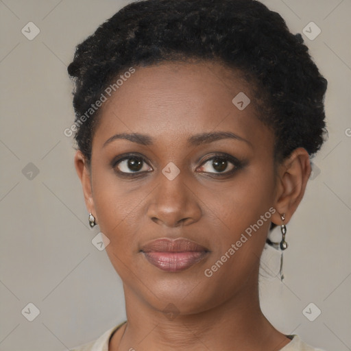 Joyful black young-adult female with short  brown hair and brown eyes